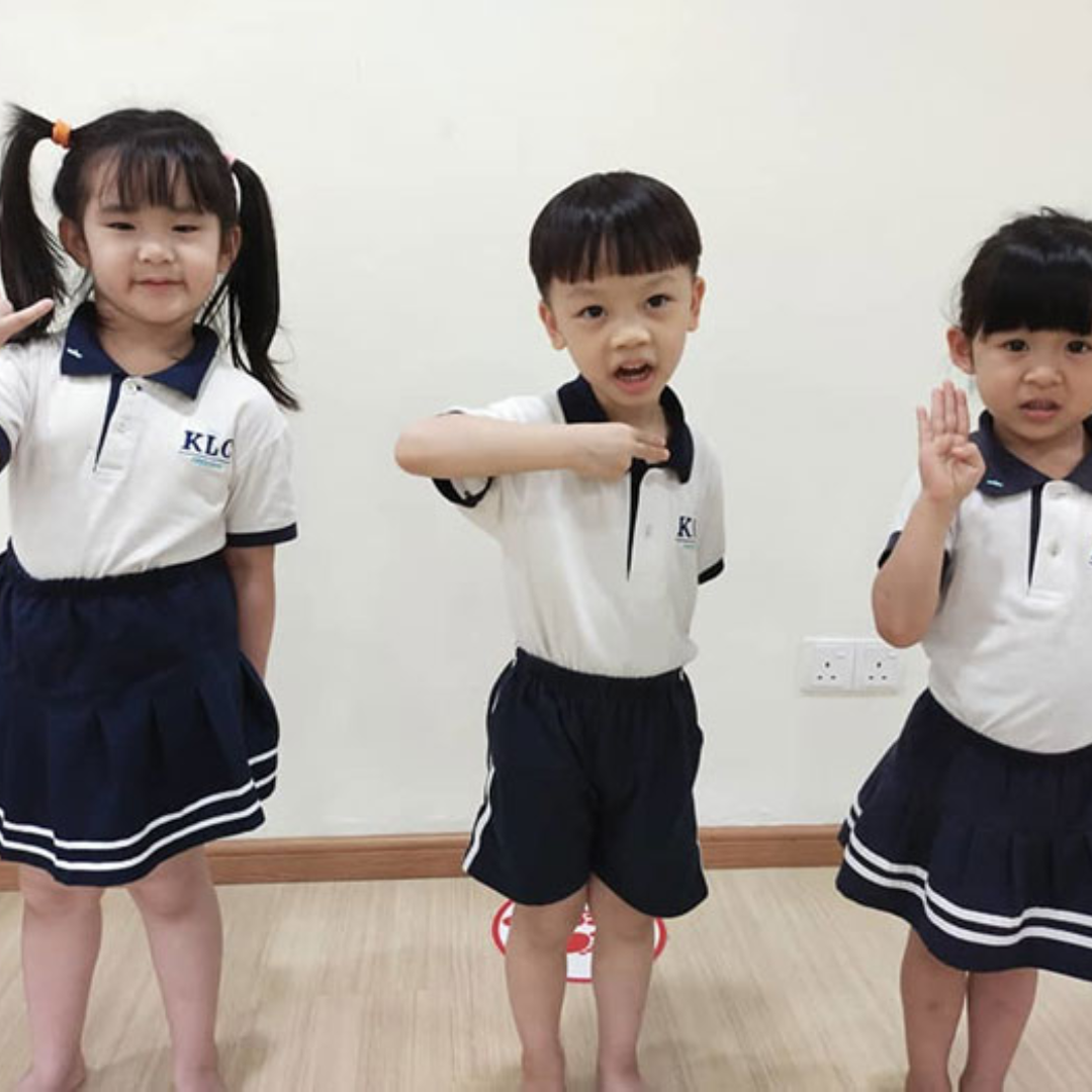 Teacher and children interacting with sign language